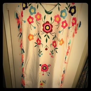 Mexican inspired dress with colorful tassels.